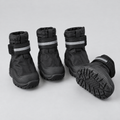 Set of four black waterproof dog boots with non-slip soles