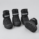 Set of four black waterproof dog boots with non-slip soles